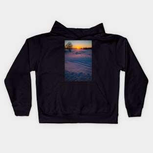 Sunset winter landscape with snow-covered road in violet and pink colors Kids Hoodie